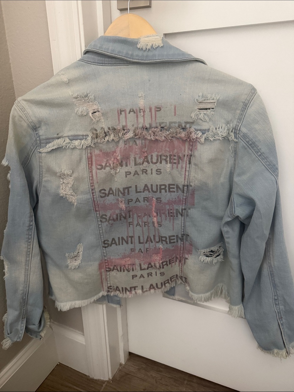 Saint Laurent Light Blue Distressed Denim Jacket with Pink Logo Print